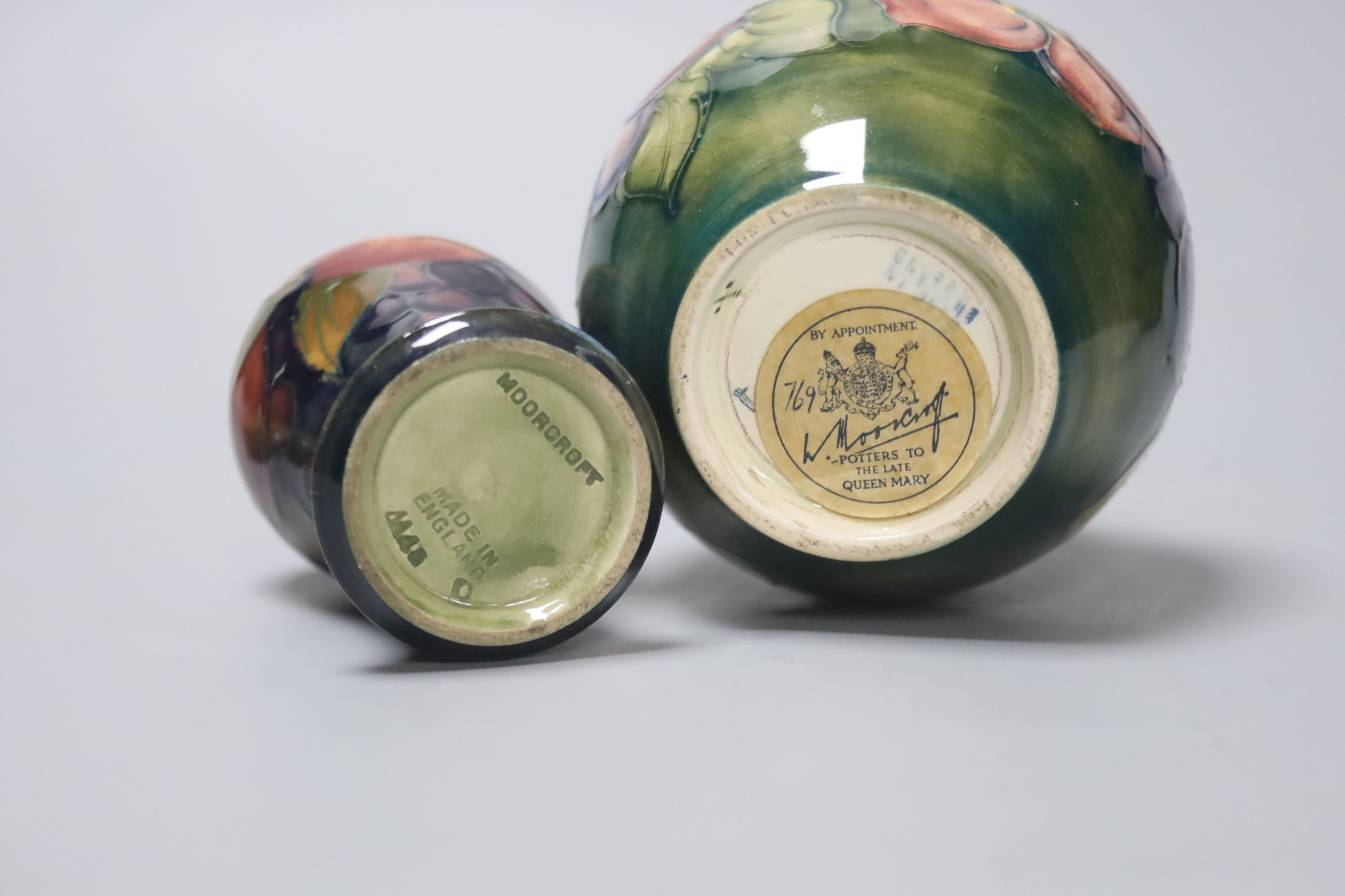 A Moorcroft Hibiscus jar and a similar Pomegranate vase, height 11cm